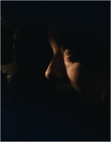 Close-up profile in low, directional light